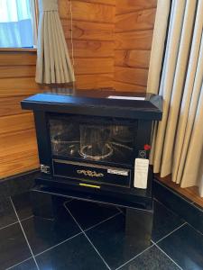 a toaster oven sitting on top of a table at Hakuba-ism in Hakuba