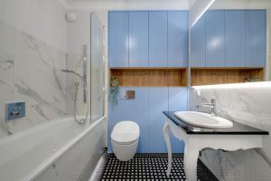 Ванна кімната в Unique Apartments - Browar Gdański