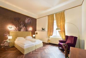 a hotel room with two beds and a lamp at BoutiqueHotel Dom - Rooms & Suites in Graz