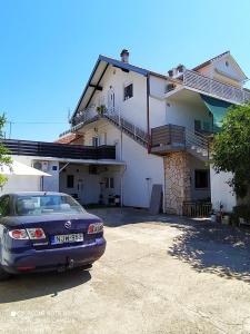 a car parked in front of a house at Cvita & Maja in Zadar