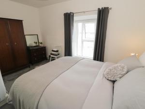 Кровать или кровати в номере Minffordd