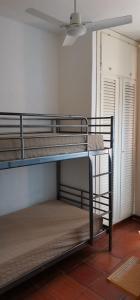 two bunk beds in a room with a ceiling at Casa Pedra Concada in Santa Marinella