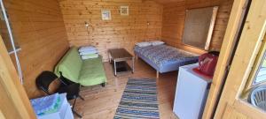 Postel nebo postele na pokoji v ubytování Laasi-Jaani Holiday Homes