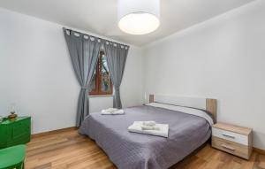 a bedroom with a bed with two towels on it at Villa Mirabella in Umag +37 photos