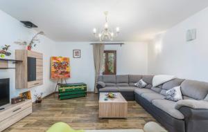 a living room with a couch and a tv at Villa Mirabella in Umag