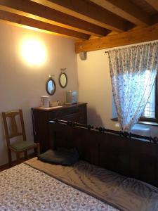 Ein Bett oder Betten in einem Zimmer der Unterkunft Agriturismo Antica Corte Contadina