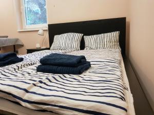 Postel nebo postele na pokoji v ubytování Gremi Apartman