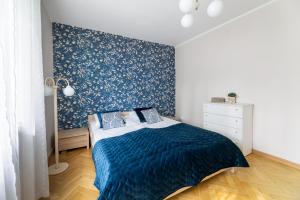 Łóżko lub łóżka w pokoju w obiekcie Apartament przy Parku