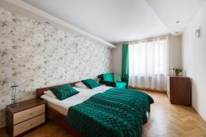 Łóżko lub łóżka w pokoju w obiekcie Apartament przy Parku