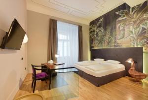 TV a/nebo společenská místnost v ubytování Boutique Hotel Dom - Rooms & Suites