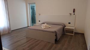 Posteľ alebo postele v izbe v ubytovaní Hotel Ogliastra