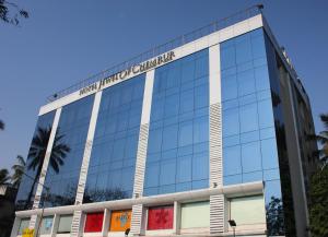 a building with a sign on the side of it at Hotel Jewel of Chembur in Mumbai
