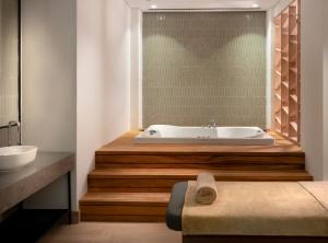 a bathroom with a tub and a sink at Radisson Collection Hotel, Bodrum in Akyarlar