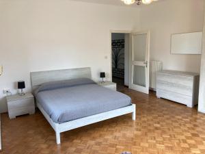 a bedroom with a bed and two night stands at Mati's House in Bellagio