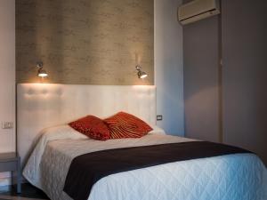 Postel nebo postele na pokoji v ubytování Hotel Metropol