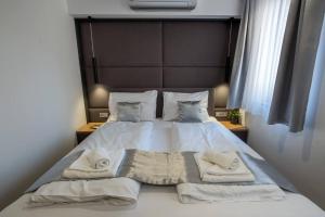 Posteľ alebo postele v izbe v ubytovaní Minaret Residence & Relax Pécs