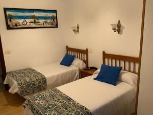 Postel nebo postele na pokoji v ubytování Hotel España