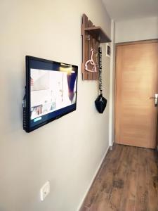 a flat screen tv hanging on a white wall at Akdeniz apart hotel in Marmaris