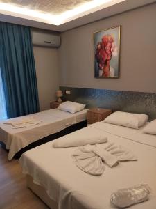 Katil atau katil-katil dalam bilik di Akdeniz apart hotel