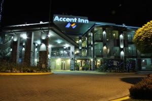 a large building with a clock on the front of it at Accent Inns Vancouver Airport in Richmond