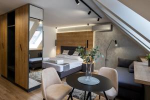 Posteľ alebo postele v izbe v ubytovaní Minaret Residence & Relax Pécs + 37 fotografií