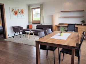 a living room with a table and a couch at Apartment Pale in Fiss