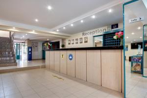 a lobby of a hospital with a reception counter at Hotel Kokiche in Sunny Beach +49 photos