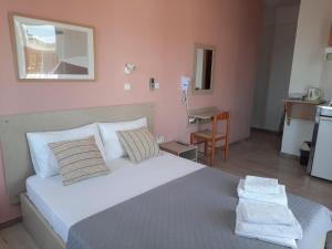 Ένα ή περισσότερα κρεβάτια σε δωμάτιο στο Ntemos Apartments