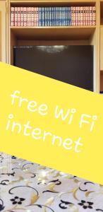 a sign that says free wifi internet in a library at Apartment PER DAY in Vrbas