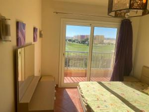 Postel nebo postele na pokoji v ubytování Golf porto marina