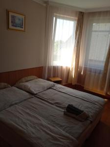 Posteľ alebo postele v izbe v ubytovaní Apartman Pávai-Silye