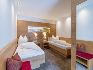 Postel nebo postele na pokoji v ubytování Hotel Post