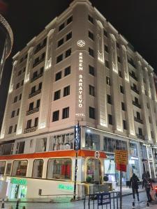 a large white building with a sign on it at Hotel Erden Sarayevo in Istanbul