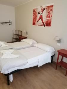 Postel nebo postele na pokoji v ubytování Ferrari Formula 1