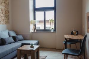 a living room with a couch and a table at Pod Jasną 28 in Częstochowa