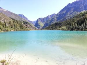 a view of a lake with mountains in the background at Casa Meneghin in Erto +8 photos