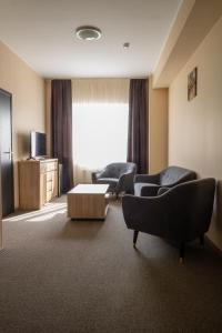 TV a/nebo společenská místnost v ubytování VILARHOTEL