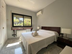 Кровать или кровати в номере TarracoHomes, TH142 Villa Vista Alegre