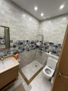 a bathroom with a toilet and a sink at Bo Islands villa in El Alamein