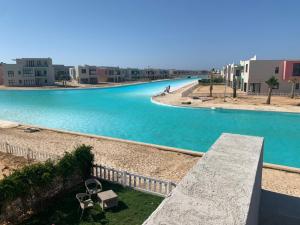 a view of a pool of water with buildings at Bo Islands villa in El Alamein