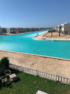 a view of the water from the balcony of a apartment at Bo Islands villa in El Alamein +17 photos