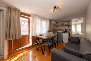 a living room with a table and a couch at Suites İstanbul in Istanbul