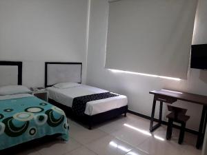 Кровать или кровати в номере Hotel Majestic