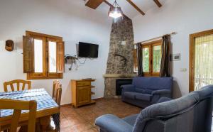 A television and/or entertainment centre at Casas Rurales Los Enebros Nerpio