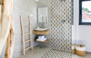a bathroom with a sink and a mirror at Gallery Luxury Suites & Rooms-Only Adults in Split
