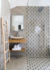 a bathroom with a sink and a shower at Gallery Luxury Suites & Rooms-Only Adults in Split