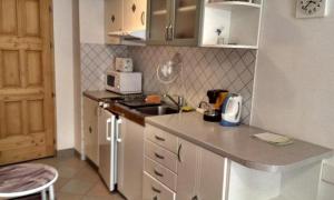 A kitchen or kitchenette at Centrum apartman