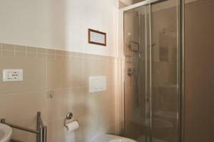 a bathroom with a shower and a toilet and a sink at MaRea in Lerici +14 photos