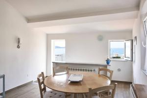 a dining room with a table and chairs at MaRea in Lerici