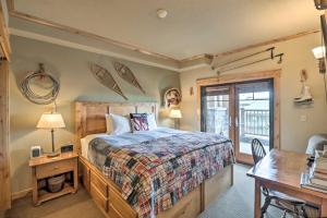 a bedroom with a bed and a desk and a desk at Ski-InandSki-Out Whitefish Escape with Balcony! in Whitefish